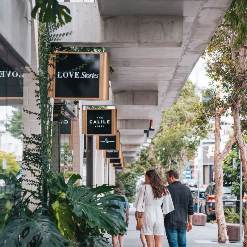 Couple window shopping at The Calile Hotel precinct